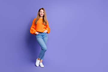 Fototapeta na wymiar Full body photo of cute cheerful person put arms pockets posing empty space ad isolated on violet color background