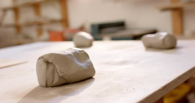 Clay lying on desk in pottery studio