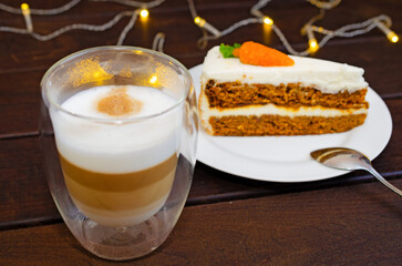 Carrot sponge cake with cream and walnuts and Cappuccino coffee