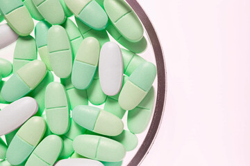 Green supplement nutrition ampules in Petri dish
