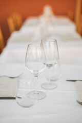Tables with clean dishes in the restaurant are set for receiving guests - siesta and the restaurant is closed
