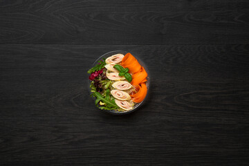 Healthy salad on dark background
