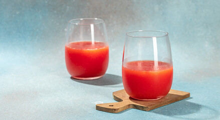 Tomato juice in a glass and fresh tomatoes. organic healthy products. Detox and clean diet concept. place for text, top view