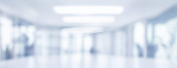 Beautiful light blue blurred background panoramic image of a spacious office or mall hallway.