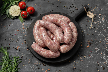 Pork sausages with pieces of paprika and spicy herbs.