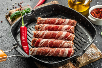 pork mince with bacon wrapped sausages. Food recipe background. Close up