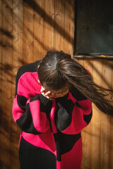 Fototapeta na wymiar Caucasian young girl covering her face.