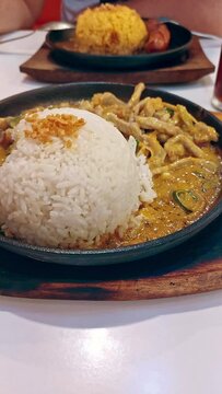 Focus to a sizzling spicy coconut milk stew called bicol express or sinilihan, an authentic local delicacy from Bicol Philippines