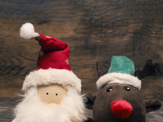 Santa and reindeer  on a wooden background