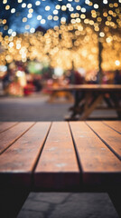 Empty wooden table and blurred background of Christmas market with bokeh.