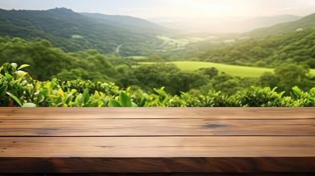 Wooden table top with blurred green tea mountain and grass field representing a fresh and relaxing concept for product display or design layout with available copy space