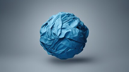 Recycled blue paper ball on gray background representing ecology and business