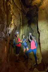 Three ladies exploring a cave