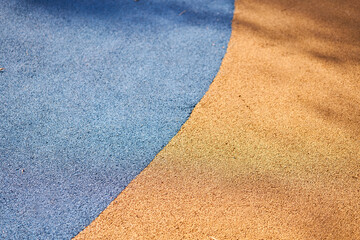 Special rubber coating for the playground or sports activity. Junction of multicolored pieces of...