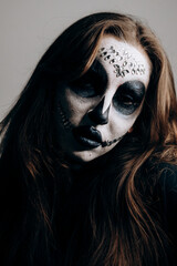 Girl with Halloween style makeup posing for the camera