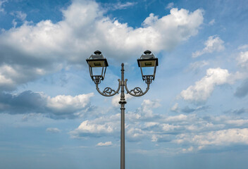 scenic view of decorative street lamp against sky clouds