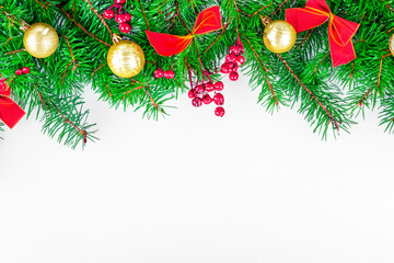 Obraz na płótnie Canvas Christmas white background with Christmas tree branches and Christmas decorations. Beautiful festive background for Christmas greeting card