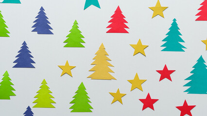 Obraz premium White background with paper texture and colorful and stylized Christmas trees and stars