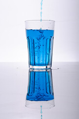Colored water studio photo with glass