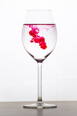 Colored water studio photo with glass