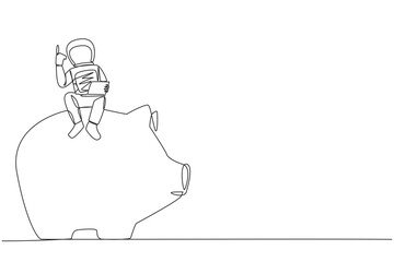 Single one line drawing young astronaut sitting on giant piggy bank holding laptop raise one hand. Saving up money for the next expedition. Galaxy cosmic. Continuous line design graphic illustration