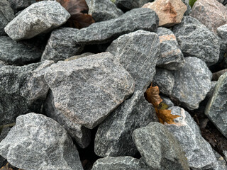 Grey crushed stones in close up. Building material for horticulture, landscape gardening or road construction. Material for railroad construction