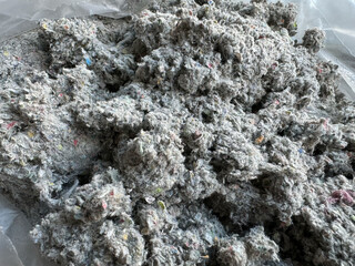 Cellulose insulation for walls and floors. Recycled newsprint. Heat preservation and energy saving
