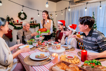 Asian family's Christmas celebration in their home Eating together at the dining table