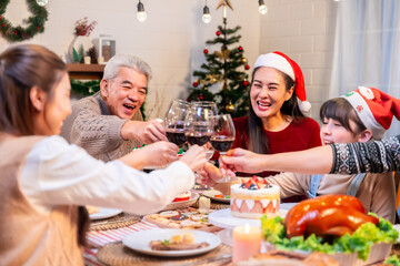 Asian family's Christmas celebration in their home Eating together at the dining table
