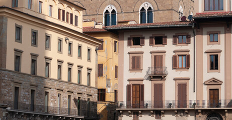 Fototapeta na wymiar Colorful historic streets of Florence, Italy. Narrow old street, building's facade, brick walls.