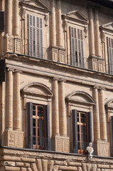 Fototapeta premium Colorful historic streets of Florence, Italy. Narrow old street, building's facade, brick walls.
