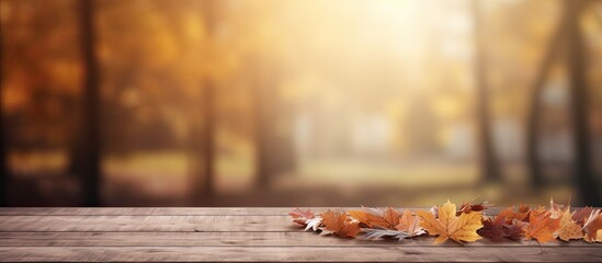 Naklejka na ściany i meble Autumn background with empty wooden table Vibrant image