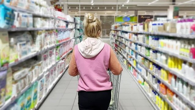 choosing a dairy products at supermarket.various goods on the supermarket shelves