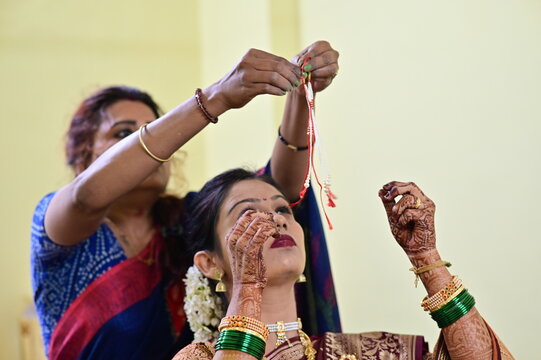 wearing traditional indian jewelry on indian bride. Indian Bride getting ready. Marathi bride. Marathi culture. Indian wedding. 