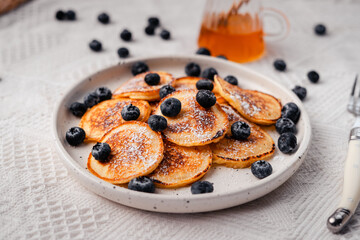 Pancake with blueberry and honey topping