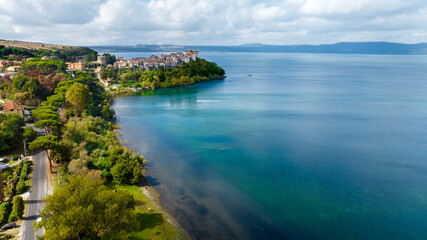Aerial view of the historic center of Anguillara, in the metropolitan city of Rome, Italy. The town is located on the shores of Lake Bracciano.