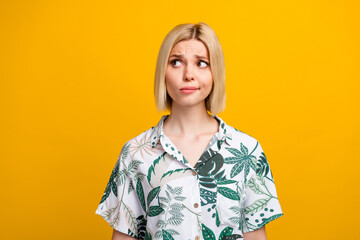 Photo portrait of lovely young lady look unsure empty space wear trendy leaves print garment...
