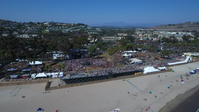 Aerial Time Lapse Shot Of People In City Against Sky, Drone Panning Over Beach - San Juan Capistrano, California