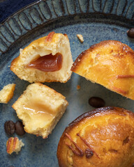 Pasticciotto leccese pastry filled with egg custard cream and sour cherry jam on a plate top view