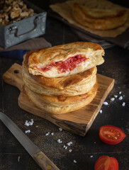 Rustico puff pastry from Lecce filled with stuffed with tomato, mozzarella and bechamel sauce