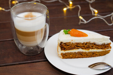Carrot sponge cake with cream and walnuts and Cappuccino coffee