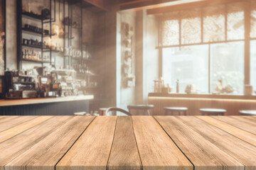 Empty wooden table space platform and blurred resturant or coffee shop background for product...