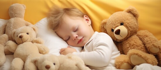 Blonde toddler boy peacefully sleeping with a teddy bear and other stuffed animals
