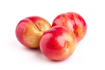 Red plum fruits, isolated on white background.