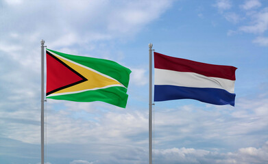Netherlands and Guyana flags, country relationship concept