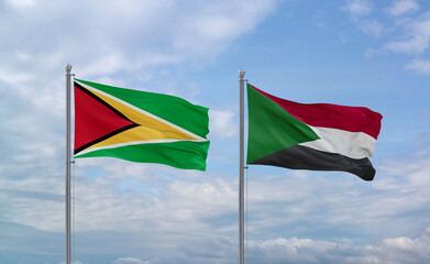 Sudan and Guyana flags, country relationship concept