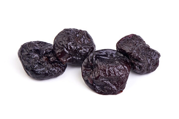 Prunes, dried fruits, close-up, isolated on white background.