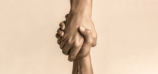 Helping hand concept and international day of peace, support. Helping hand outstretched, isolated arm, salvation. Close up help hand. Two hands, helping arm of a friend, teamwork - obrazy, fototapety, plakaty