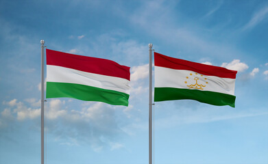 Tajikistan and Hungary flags, country relationship concept
