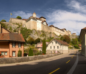 Fototapeta na wymiar Aarburg from street level showing the castle and traditional buildings, Canton of Aargau